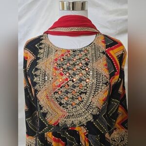 Embellished Black and Gold Dress with Red Accents